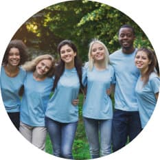 group of volunteers outdoors smiling