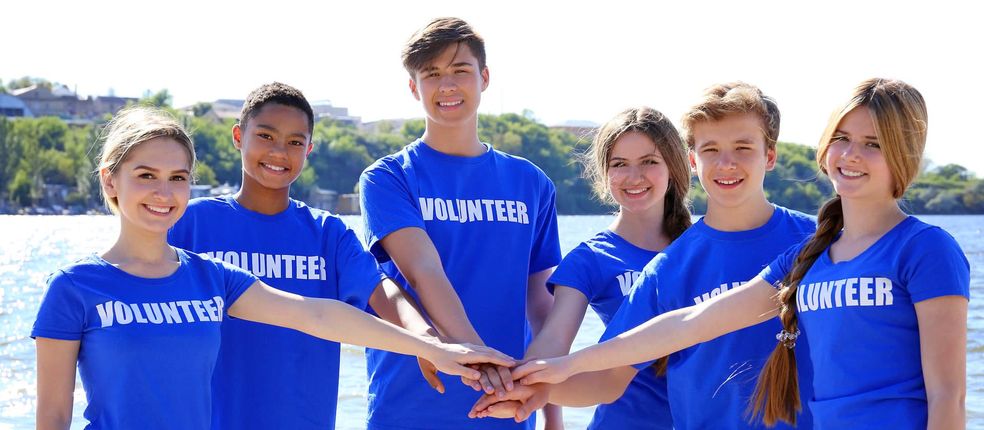 group of volunteers stacking their hands