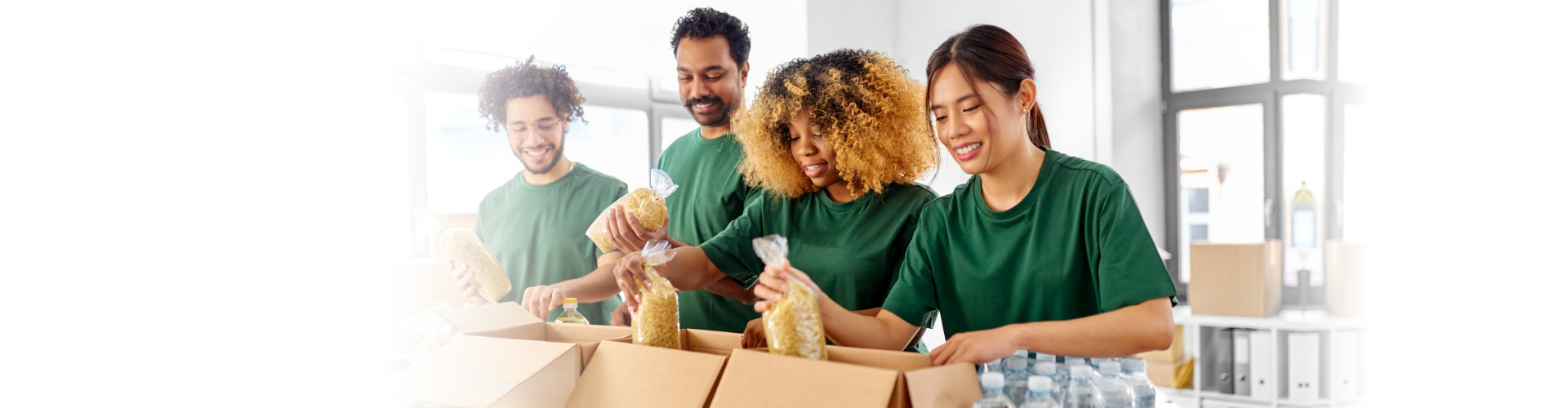 volunteers re-packing goods